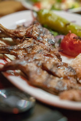 Braised Lamb Chops, traditional Middle Eastern food. Selective focus. Vertical shot