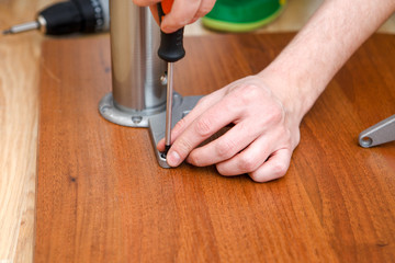 Image of man picking furniture