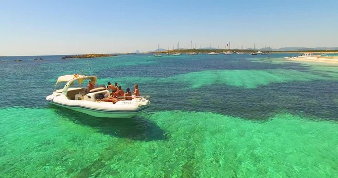 Aerial view of Yatch with friends in amazing, unspoiled and idyllic beach on a little island