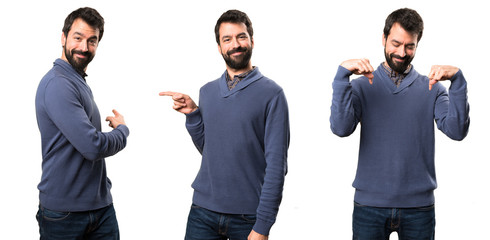 Set of Handsome brunette man with beard pointing to the lateral, back and down