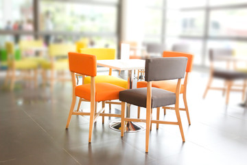 Dining area with colorful tables and chairs