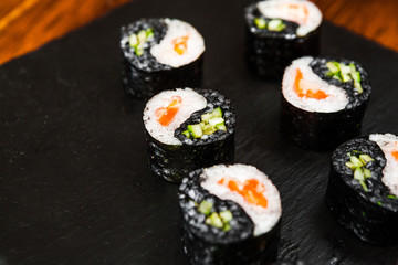 dishes of Japanese cuisine rolls with fish