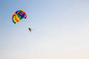 Paraseyling. Beautiful flight with a parachute over the sea at sunset. Thailand. Active rest.