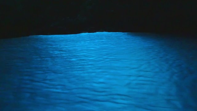 Amazing beautiful blue water in Blue cave attraction on island Vis in Croatia. Tourist attraction blue cave called plava spilja in Croatia.