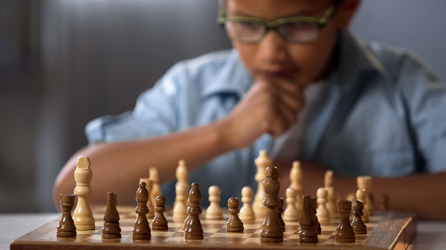 Kids Early Development. Pupil Kid Thinking about His Next Move in a Game of  Chess. Stock Image - Image of child, chess: 172839087