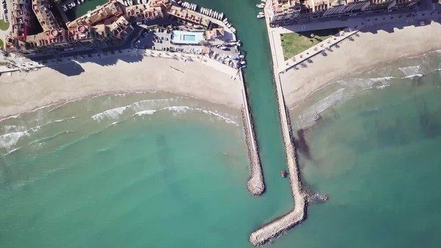 Spain, Port Saplaya, aerial shooting , nice view of port, bay and village of port Saplaya. colorful houses and boats