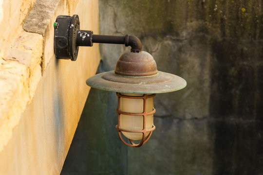 Old Outdoor Light Fixture In A Stairwell