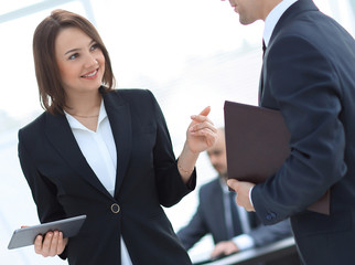 business colleagues discussing work issues at the office