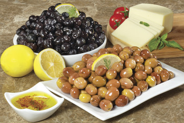 green and black olives on a plate