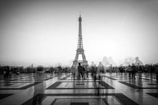 Blurred people on Trocadero square admiring the Eiffel tower, Paris, France