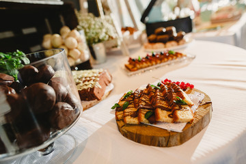 Elegant candy bar for a wedding full of pastries