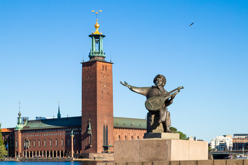 Stockholm City Hall and Evert Taube statue