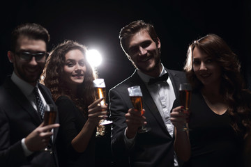 portrait of a group of friends celebrating their success