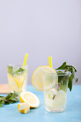 Detox lemon water in two glasses. Delicous homemade lemonade