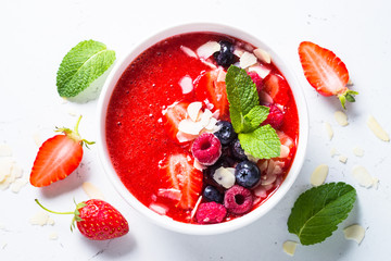 Smoothie bowl with fresh berries and almond. 