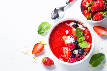 Smoothie bowl with fresh berries and almond. 