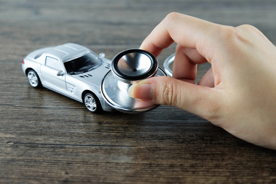 Stethoscope checking up the car, Concept of car check-up, repair and maintenance..