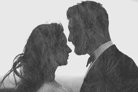 Double exposure effect of a young couple of bride and groom kissing over grass. Close up. Multiple exposure. Black and white
