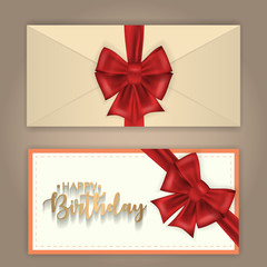 Birthday greeting envelope decorated with bow and ribbon.