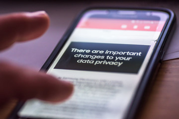 General Data Protection Regulation - GDPR - closeup human finger pointing to smartphone message There Are Important Changes To Your Data Privacy