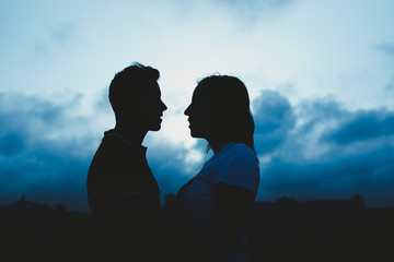 Backlight of a couple kissing