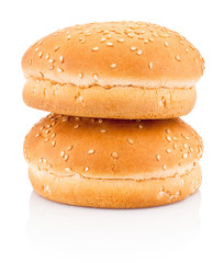 Two hamburger buns with sesame isolated on white background