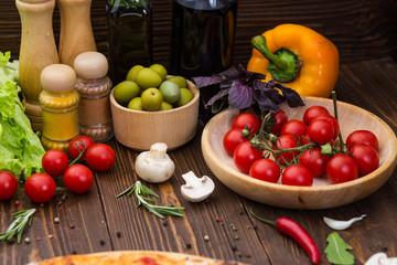 Pizza cooking ingredients. Dough, vegetables, cheese and spices