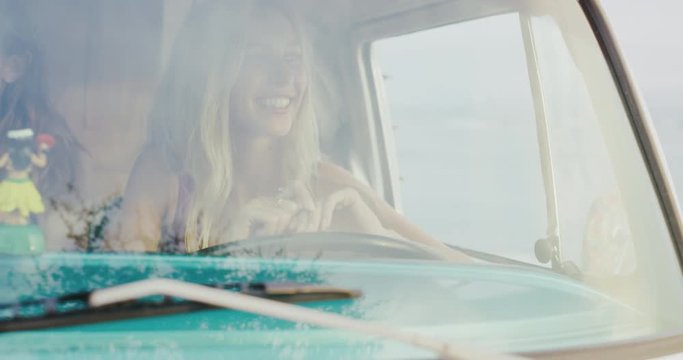 Friends on road trip in vintage surf van