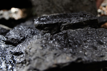 Close up of black coal pile. Coal mining