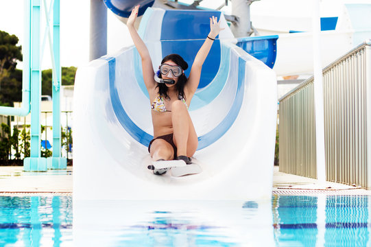 girl rolls on water slides