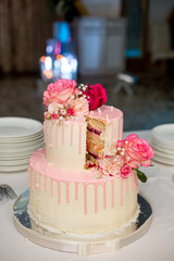 Wedding cake decorated with red roses