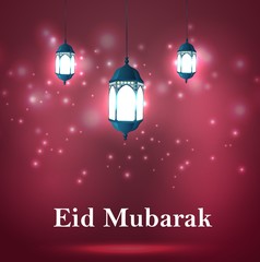 Eid Mubarak Greetings with arabic lanterns in a glowing background