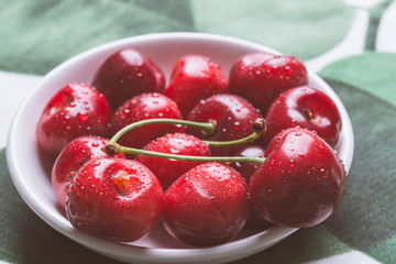Fresh Ripe Cherries in White Bowl with Copy Space. Summer and Harvest Concept.