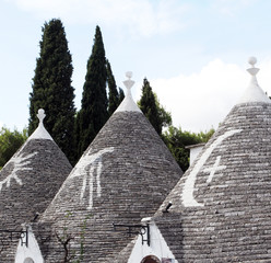 Alberobello, Puglia Region, South of Italy. Trulli di Alberobello.  Traditional roofs of the...