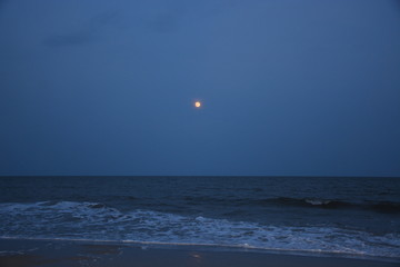 Full moon over beach
