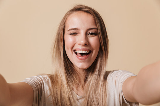Portrait of a happy young girl taking a selfie