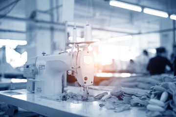 weaving loom at a textile factory, closeup. industrial fabric production line