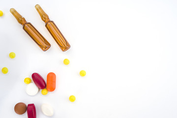 Tablets and ampoules isolated on white