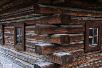 ancient wooden wall and window, of Cossack state guard army troop 16-18 centuries. Khortytsia island on broad Dnipro summertime, vintage houses construction technology background