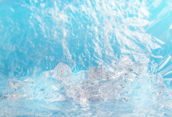 Fresh background with group of ice cube for product presentation in freshness or summer concept. Light blue color background.