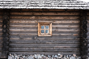 ancient wooden wall and window, of Cossack state guard army troop 16-18 centuries. Khortytsia island on broad Dnipro summertime, vintage houses construction technology background