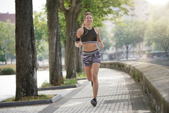 Woman jogger exercising in town