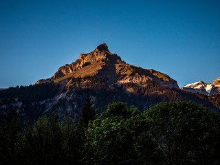 mountain peak in golden light, sunset