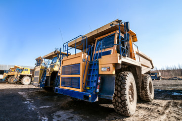 Obraz premium Yellow dump trucks