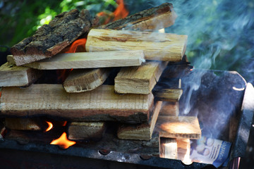 Burning wood in the grill