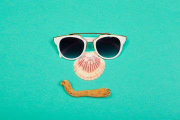 Top view. Fashion sunglasses on pastel background