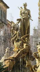 Famous Artemis (Diana) Fountain on Archimedes Square on the Ortygia isle, Sicily, Italy