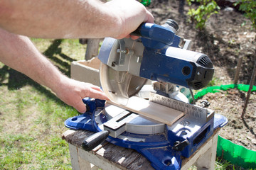 Circular Saw. Carpenter Using Circular Saw for wood