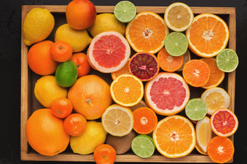 Assorted cirtus fruits background, top view