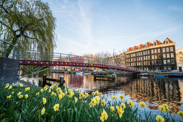 Bridge in Amsterdam with canal and traditional houses